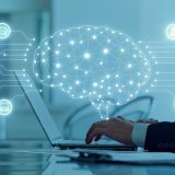 Person typing on a laptop with a glowing, interconnected brain graphic and floating tech icons representing AI and connectivity.